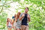 group of adults hiking in woods